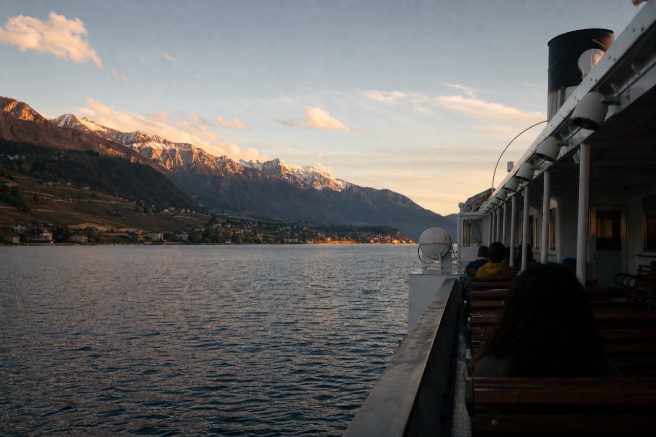 A CGN cruise boat on Lake Geneva off Montreux, the Alps across the water and Lavaux vineyard slopes along the Swiss shore