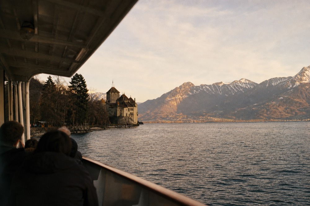 Château de Chillon on the shore of Lake Geneva near Veytaux, seen from a scheduled cruise boat