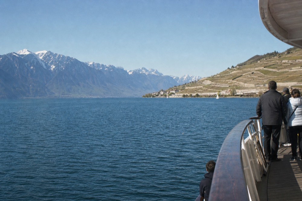 The Lavaux vineyard terraces and the Alps seen across Lake Geneva from a Riviera cruise near Montreux