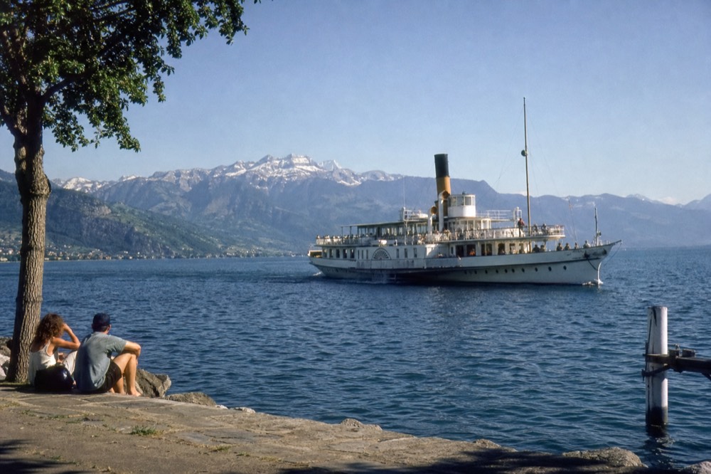 A Belle Époque paddle steamer on Lake Geneva off Montreux in summer, the Alps across the water